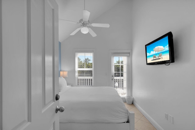 bedroom with light tile patterned floors, a ceiling fan, baseboards, vaulted ceiling, and access to outside