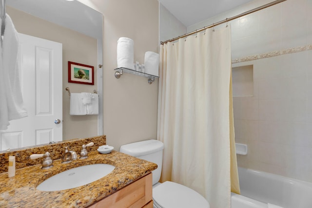 bathroom featuring toilet, shower / tub combo, and vanity