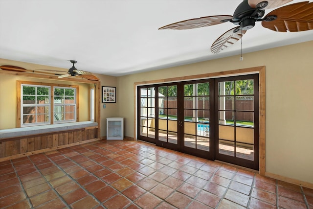 1613 Bahama Dr, Key West, FL 33040 - tiled empty room with a ceiling fan, healthy amount of natural light, and baseboards