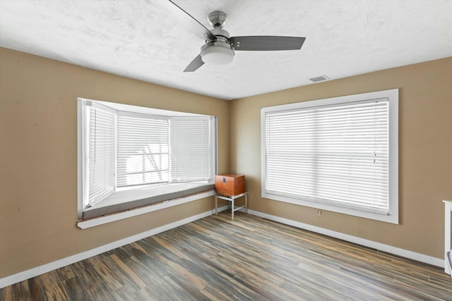 1613 Bahama Dr, Key West, FL 33040 - empty room featuring baseboards, wood finished floors, and plenty of natural light