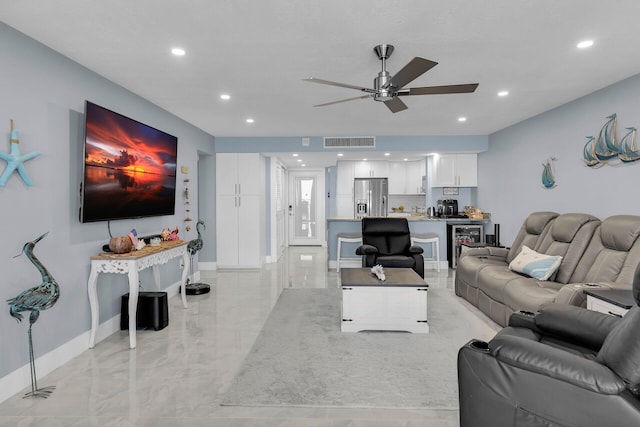 living room featuring beverage cooler, visible vents, baseboards, ceiling fan, and recessed lighting