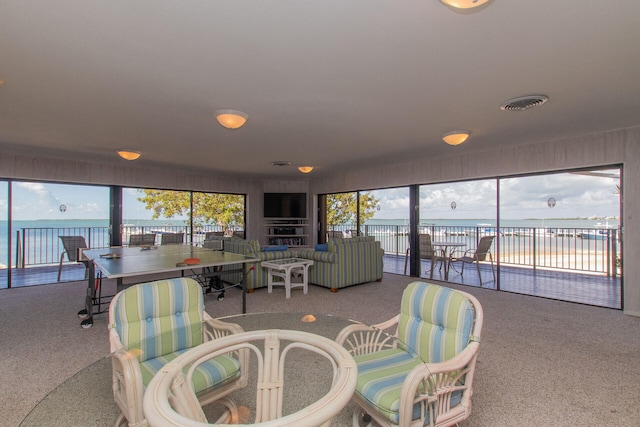 carpeted living room featuring visible vents