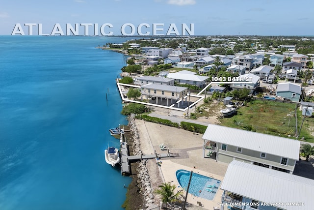 bird's eye view featuring a residential view and a water view