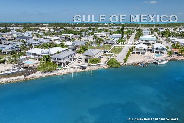 aerial view featuring a residential view and a water view