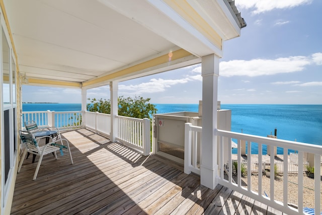 wooden deck featuring a water view