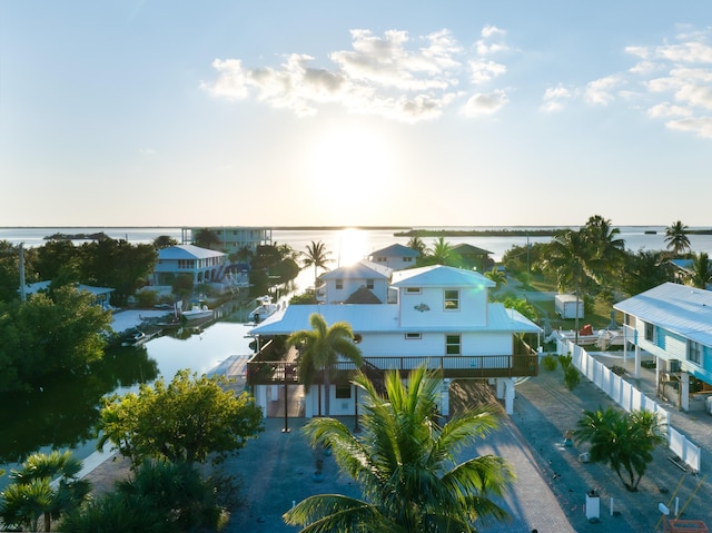 aerial view with a water view and a residential view