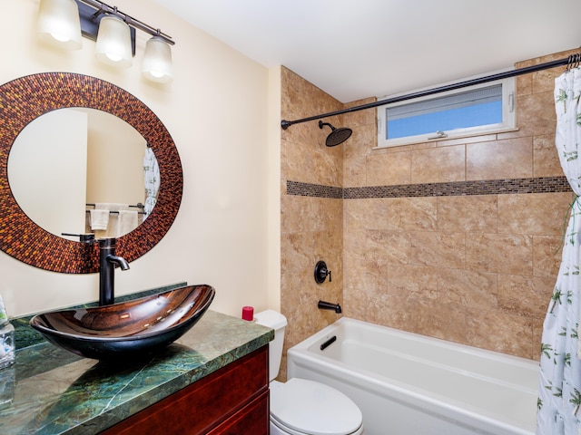 bathroom with toilet, vanity, and shower / bathtub combination with curtain