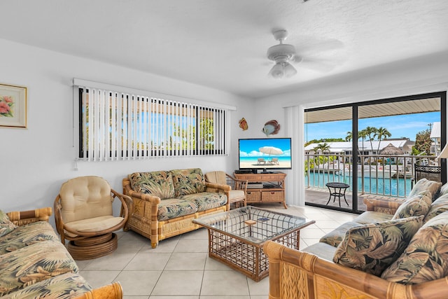 5019THST & St, Key Colony, FL 33051 - living area featuring tile patterned floors, a ceiling fan, and plenty of natural light