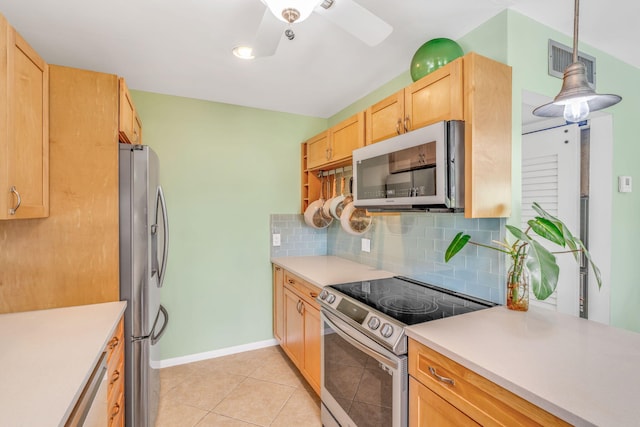 17126 Wahoo Ln, Sugarloaf, FL 33042 - kitchen featuring stainless steel appliances, tasteful backsplash, light brown cabinets, light countertops, and light tile patterned floors
