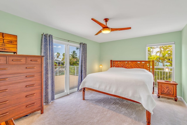 17126 Wahoo Ln, Sugarloaf, FL 33042 - bedroom featuring access to outside, multiple windows, light carpet, and ceiling fan