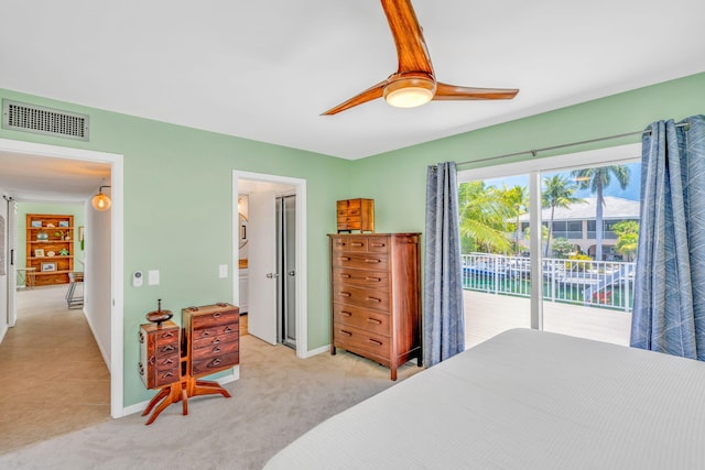 17126 Wahoo Ln, Sugarloaf, FL 33042 - bedroom featuring access to exterior, light carpet, baseboards, and a ceiling fan