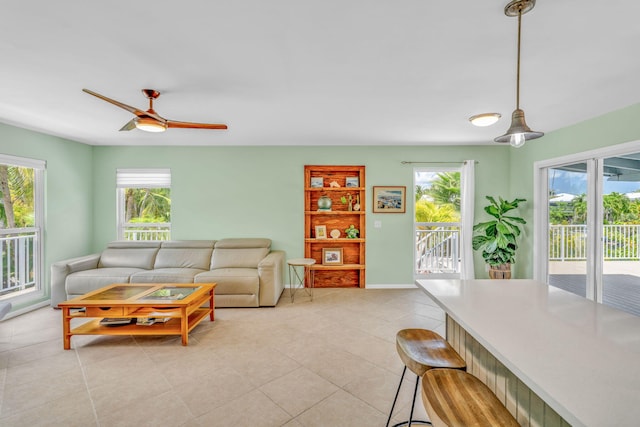 17126 Wahoo Ln, Sugarloaf, FL 33042 - living area featuring plenty of natural light, a ceiling fan, and light tile patterned floors