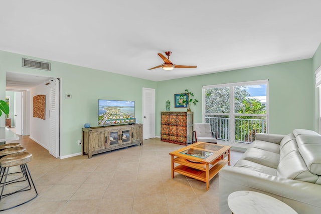 17126 Wahoo Ln, Sugarloaf, FL 33042 - living area with a ceiling fan, light tile patterned flooring, and baseboards