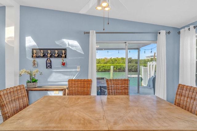 dining area with lofted ceiling and a ceiling fan