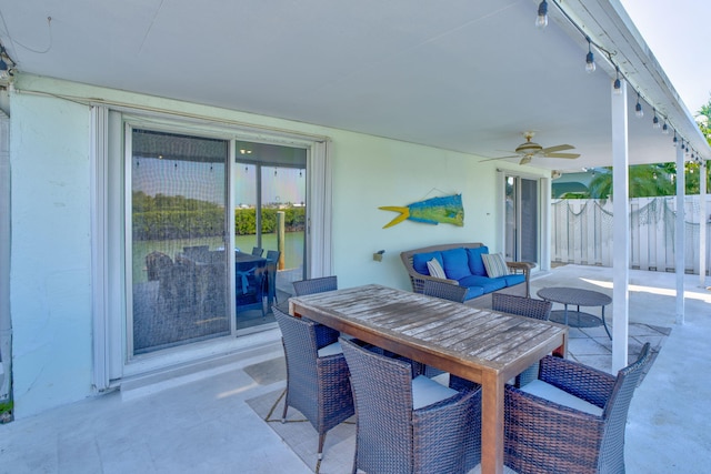 view of patio / terrace featuring a ceiling fan, fence, and an outdoor hangout area