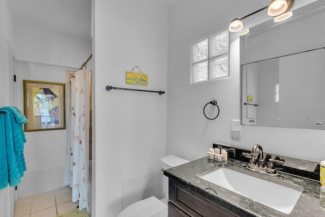 bathroom featuring toilet, tile patterned floors, vanity, and a shower with curtain