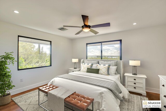 bedroom featuring visible vents, baseboards, ceiling fan, dark wood-style flooring, and recessed lighting