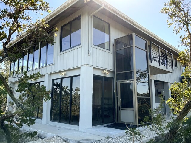 view of home's exterior featuring a sunroom