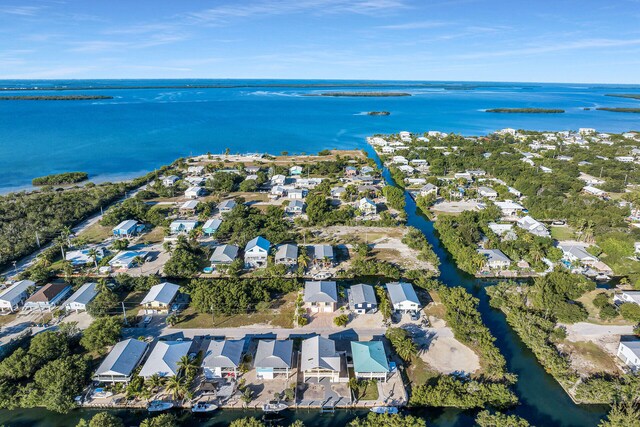 aerial view featuring a residential view and a water view