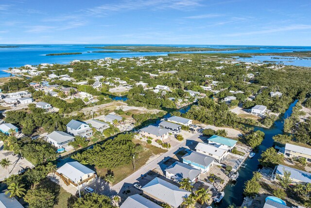 bird's eye view featuring a water view and a residential view