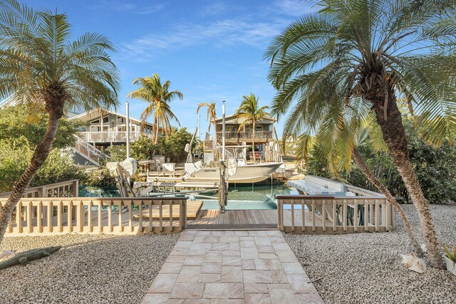 exterior space featuring boat lift and a boat dock