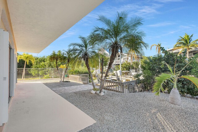 view of patio featuring fence