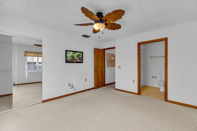 unfurnished bedroom featuring a closet, visible vents, baseboards, and carpet