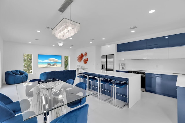 dining space with visible vents, concrete flooring, and recessed lighting