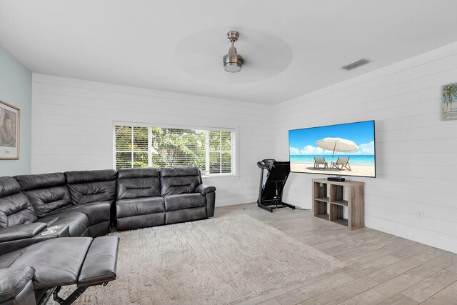 241 Seaview Dr, Duck, FL 33050 - kitchen featuring appliances with stainless steel finishes, wall chimney range hood, open floor plan, light wood-style flooring, and tasteful backsplash