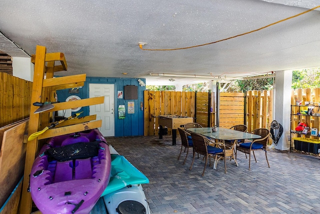 exterior space featuring fence and outdoor dining space