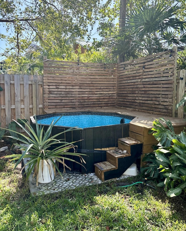 outdoor pool featuring fence