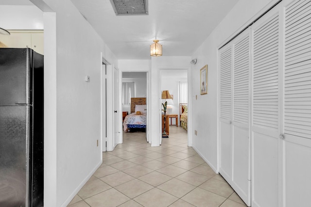501 9th St, Key Colony, FL 33051 - hall featuring light tile patterned floors and baseboards