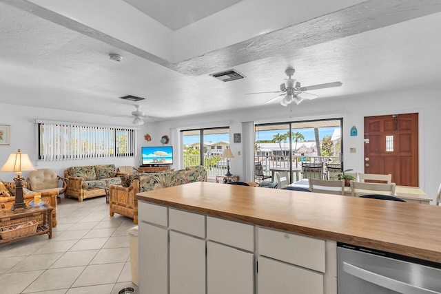 501 9th St, Key Colony, FL 33051 - kitchen featuring ceiling fan, a textured ceiling, dishwasher, open floor plan, and white cabinets