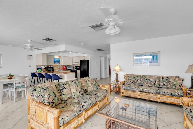 501 9th St, Key Colony, FL 33051 - living room with ceiling fan and light tile patterned floors