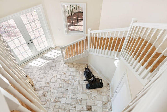 stairway featuring french doors