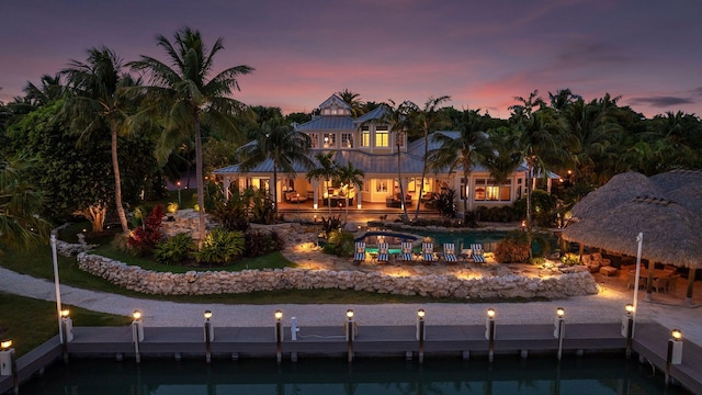 view of back of house at dusk