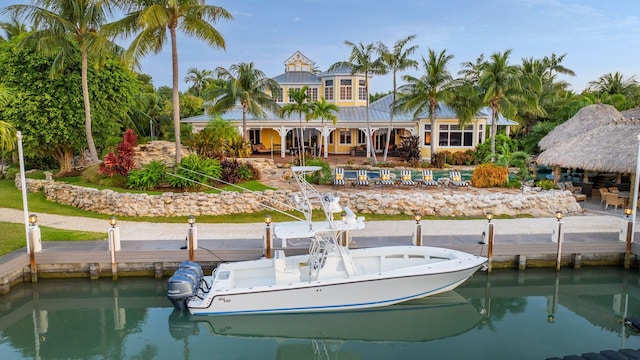 rear view of property with a water view