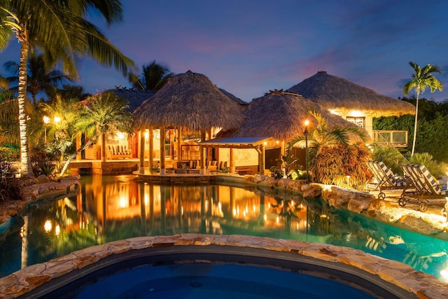 view of swimming pool with a gazebo and a mountain view