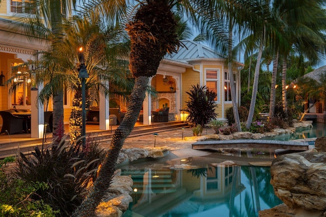 view of swimming pool with a fireplace