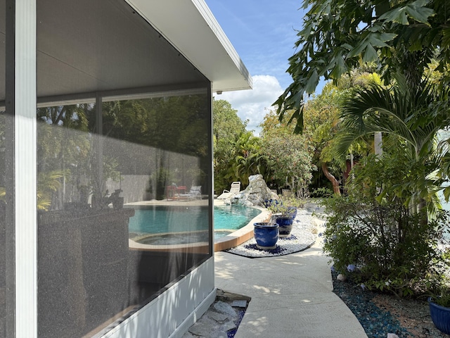 outdoor pool featuring a patio