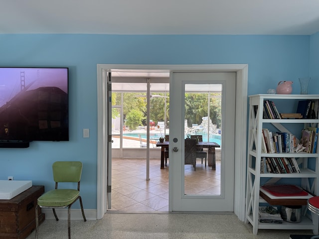 entryway with baseboards and french doors