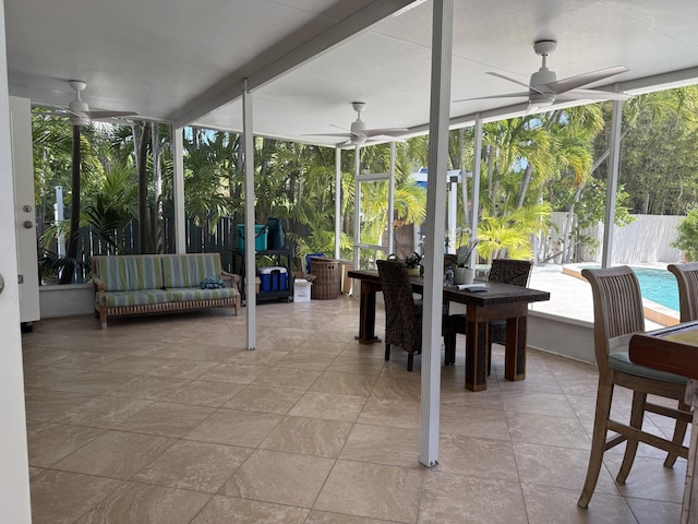 sunroom with a ceiling fan