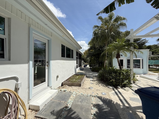 view of side of home featuring stucco siding