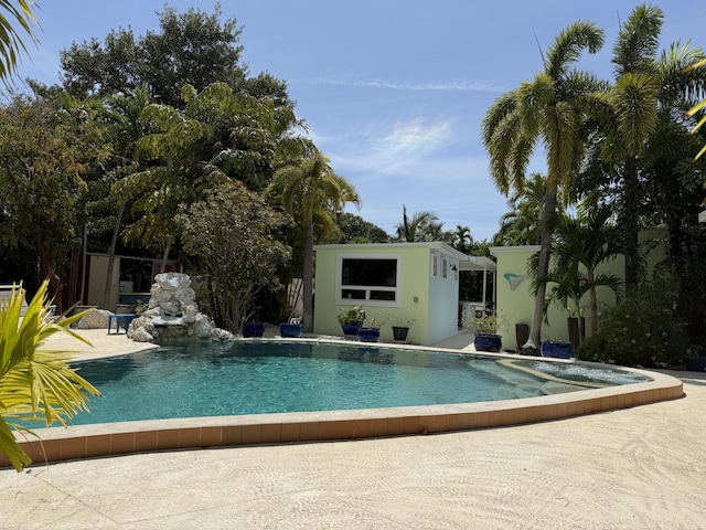 pool with an outbuilding