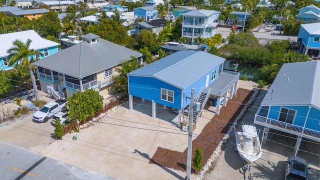 birds eye view of property with a residential view