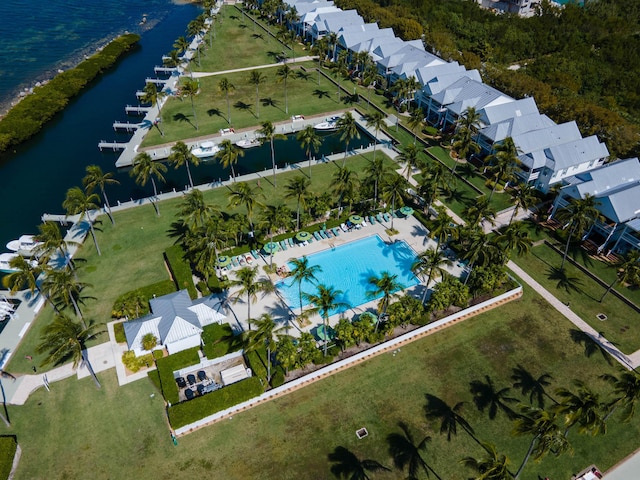 birds eye view of property featuring a water view and a residential view