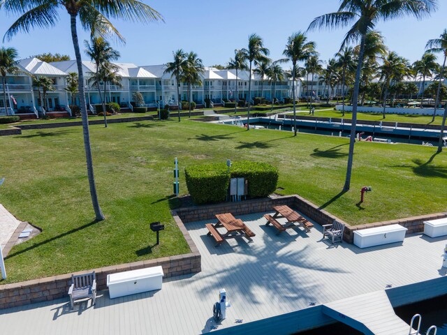 surrounding community featuring a yard and a residential view