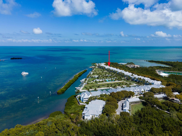 birds eye view of property featuring a water view and a residential view