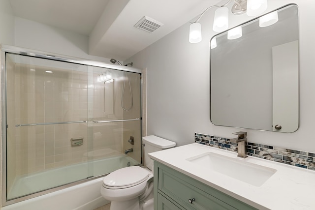 full bathroom featuring decorative backsplash, visible vents, toilet, vanity, and enclosed tub / shower combo