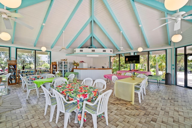 sunroom / solarium featuring beam ceiling